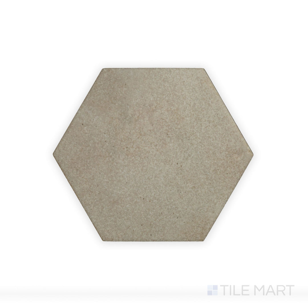A zoomed-in look at Celine Taupe 4" Hex Matte Glazed Porcelain tile showcases its earthy taupe hue and matte finish, adding depth and warmth to geometric layouts.