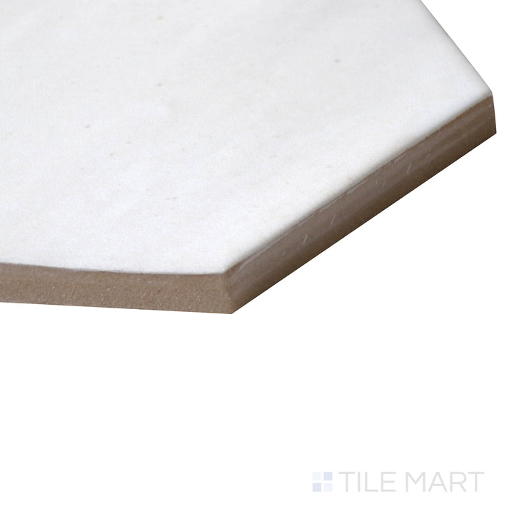 Angled perspective of Celine White 4" hex gloss glazed porcelain tile, featuring a bright white tone, reflective glossy finish, and well-defined hexagonal pattern.