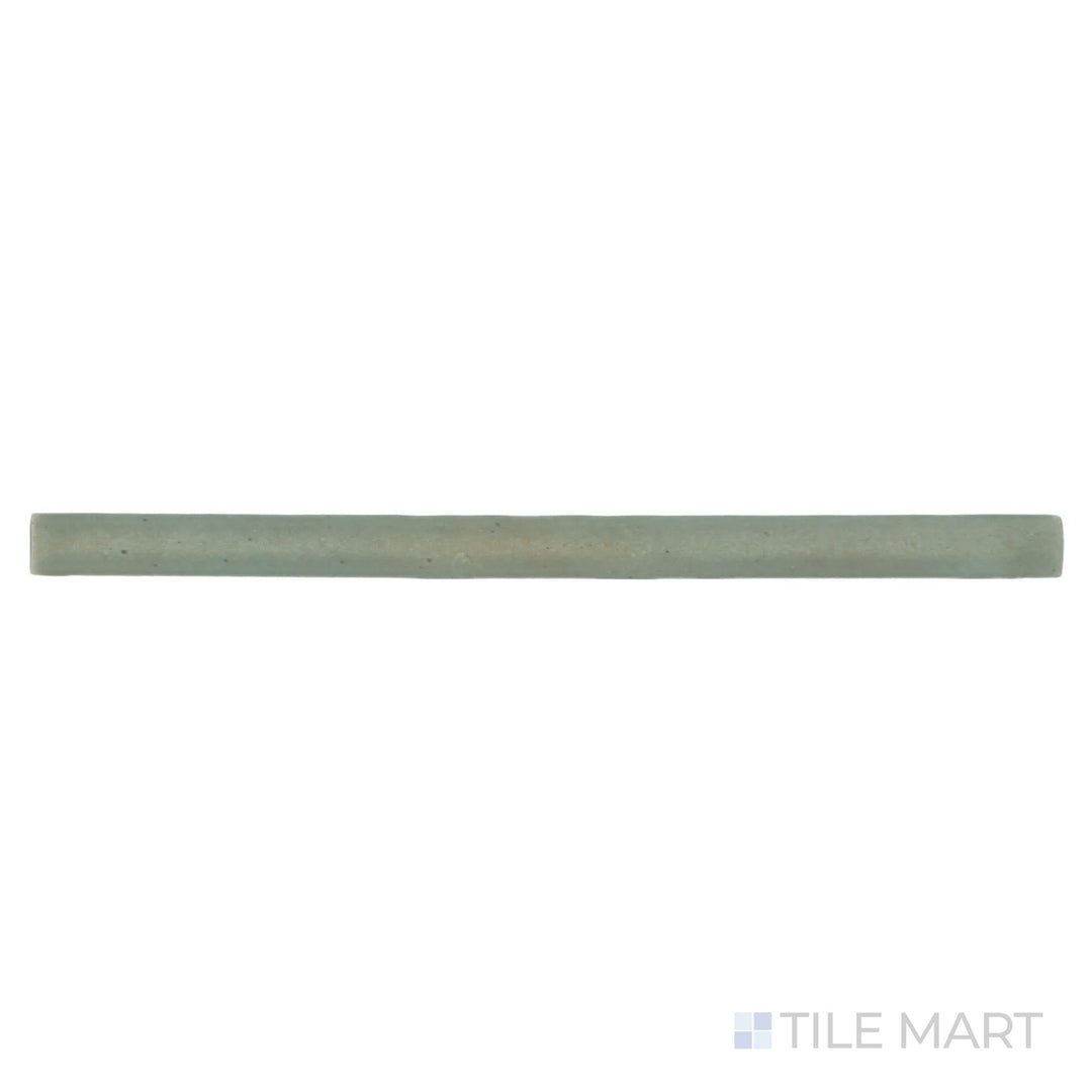 An overhead shot of the Celine Sage 0.5X8 matte glazed porcelain Jolly trim tile displays its calming green tone, blending nature-inspired elegance with functional edge detailing.