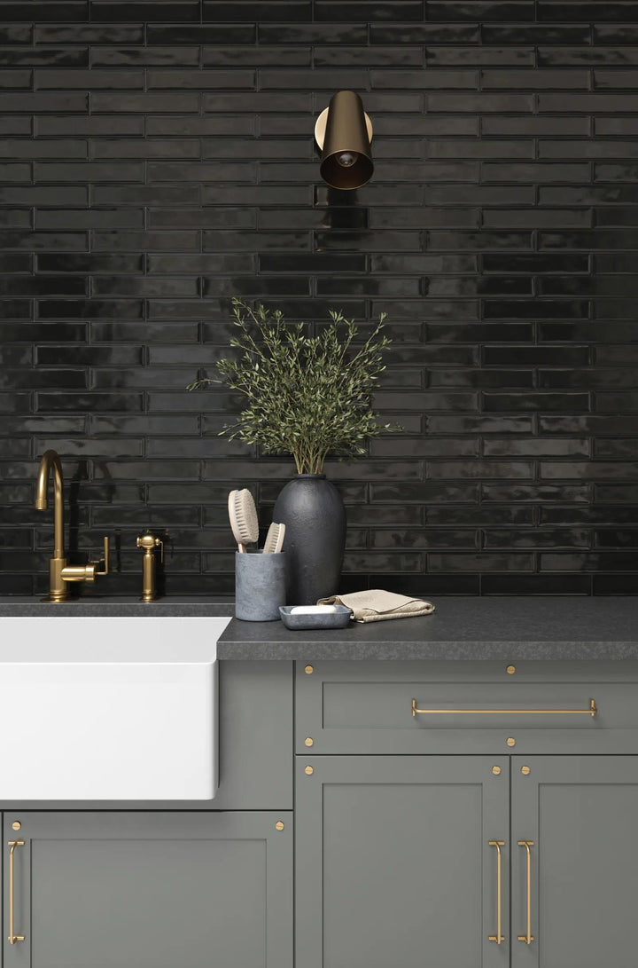 A striking glossy noir shade for a bold and modern aesthetic, featuring Clara Noir 2.75X11 Glossy Glazed Porcelain.