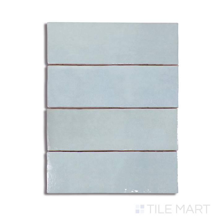 A crisp close-up shot of Cloe Baby Blue 2.5X8 Gloss Glazed Ceramic tile highlights its delicate pastel hue and high-gloss finish, reflecting light beautifully.
