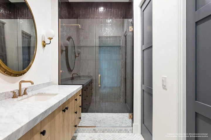 A deep black glossy glazed ceramic tile, Cloe Black 2.5x8 adds dramatic contrast with a rich, reflective finish.