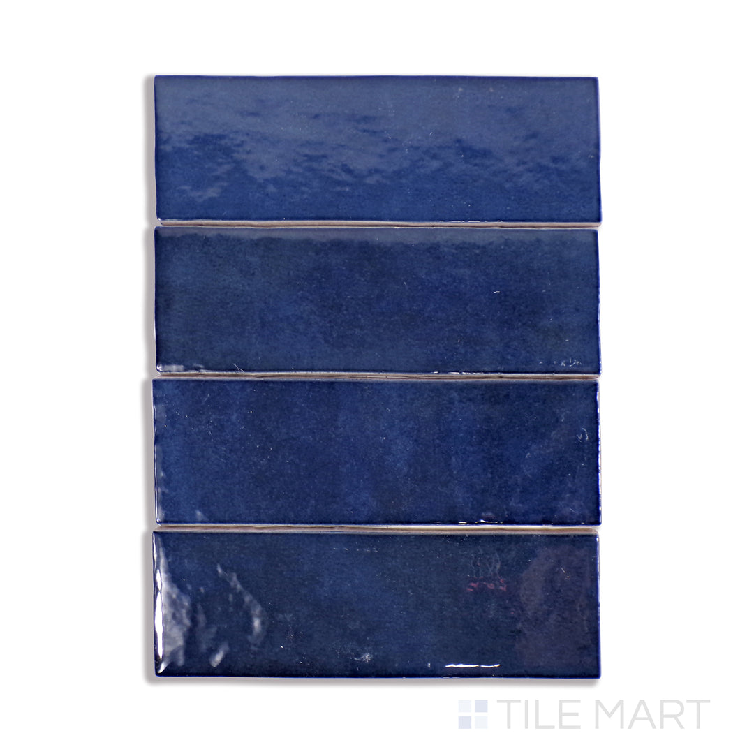 A finely detailed macro shot of Cloe Blue 2.5X8 Gloss Glazed Ceramic tile showcases its rich blue color and glossy glaze, creating a striking and modern appeal.