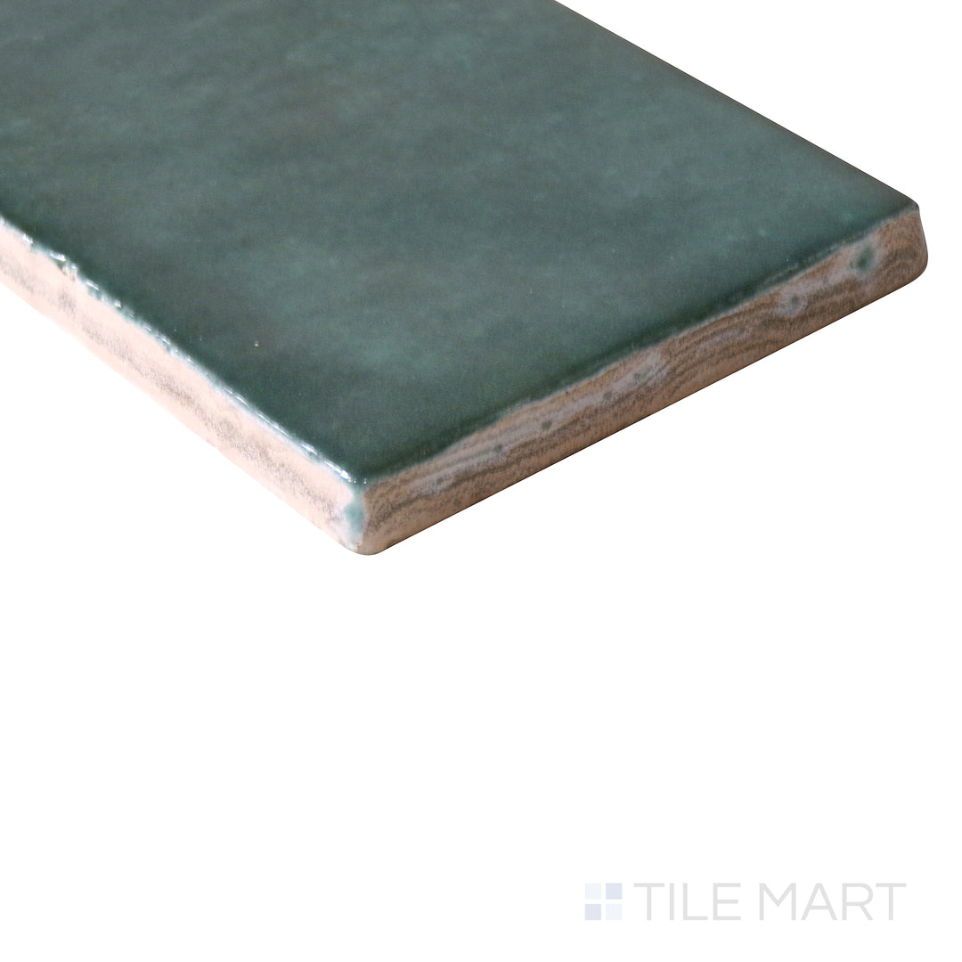 Corner-focused image of Cloe Green 2.5x8 gloss glazed ceramic tile, emphasizing its vibrant green tone, smooth reflective surface, and clean-cut corner alignment.