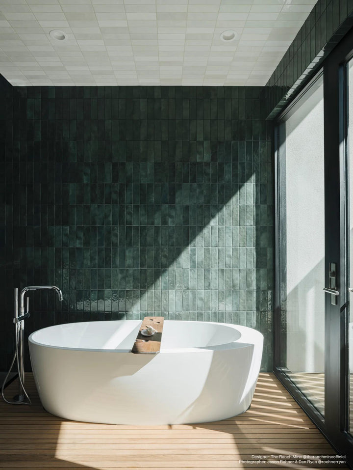 A vibrant and refreshing kitchen backsplash featuring Cloe Green 2.5x8 gloss glazed ceramic tiles. The deep green hue and glossy finish add a touch of luxury and personality to any space.