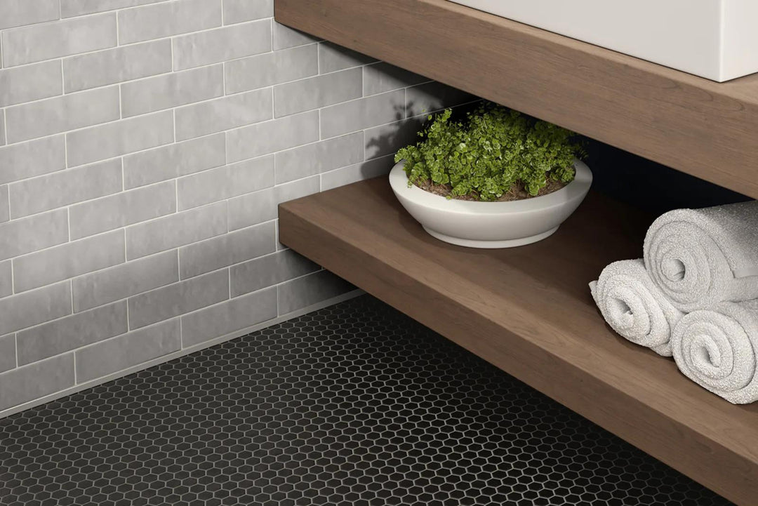 A refined gray tone with a reflective gloss elevates the surroundings, harmonizing with Cloe Grey 2.5X8 Gloss Glazed Ceramic.