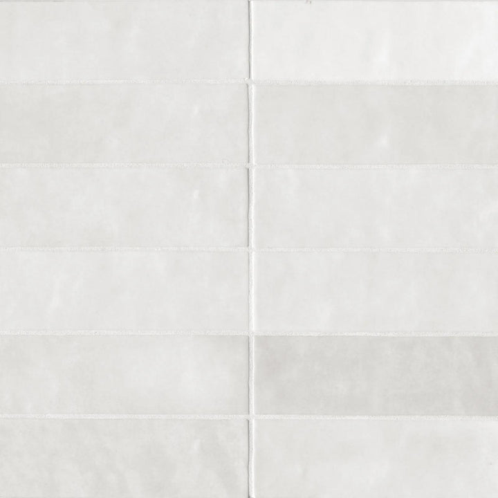 A bird’s-eye view of the Cloe White 2.5X8 glossy ceramic tile reveals its pristine white shade and ultra-glossy surface, creating a luminous, timeless elegance.