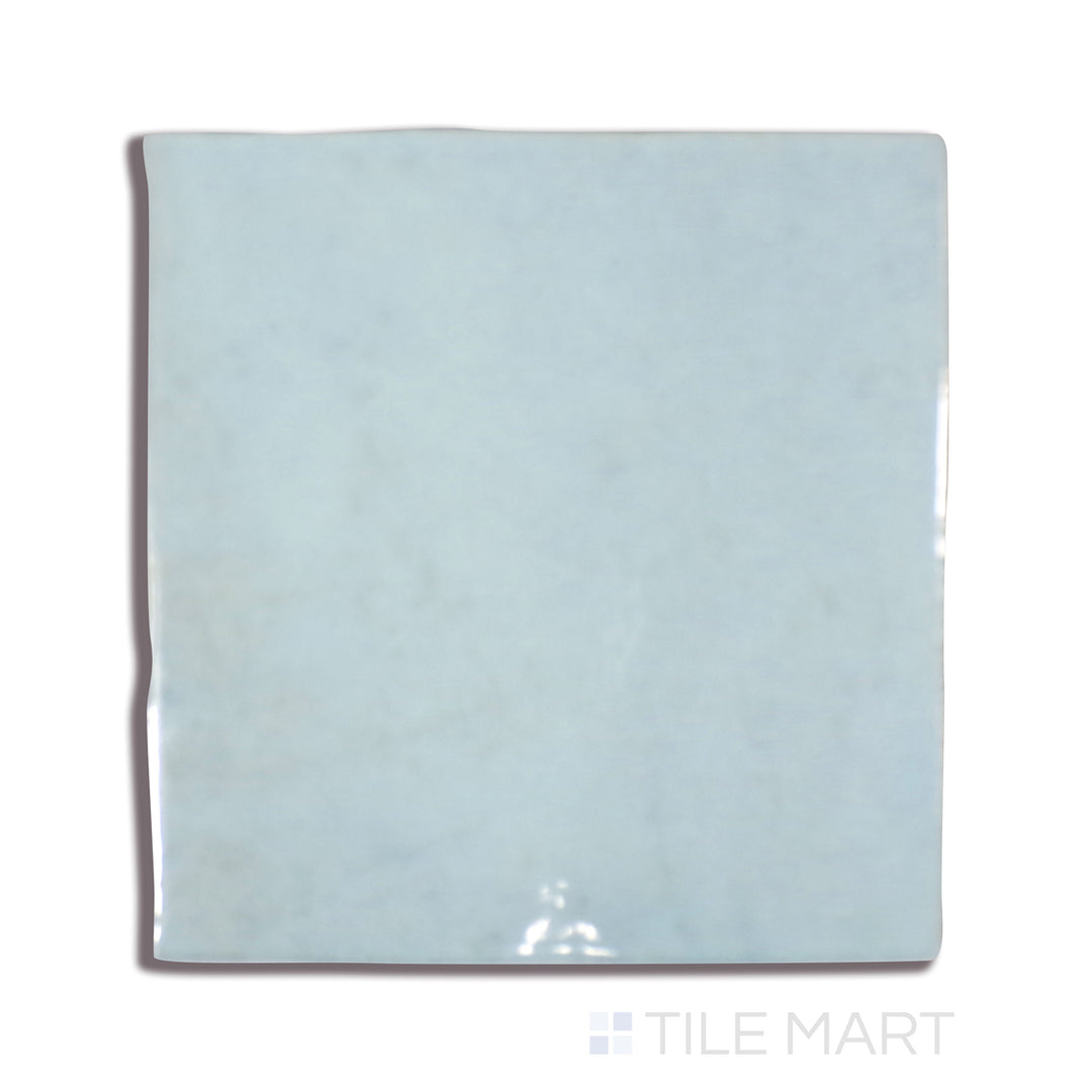 A close-up look at Cloe Baby Blue 5X5 Gloss Glazed Ceramic tile showcases its charming pastel blue hue and lustrous glazed surface, enhancing light and color in any setting.
