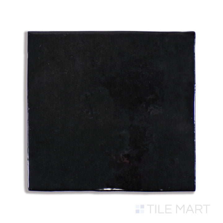 An up-close shot of Cloe Black 5X5 Gloss Glazed Ceramic tile captures its deep black tone and sleek glossy finish, delivering a bold and contemporary feel.
