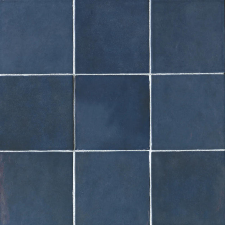 Captured from above, the Cloe Blue 5X5 glossy ceramic tile exhibits a rich, oceanic tone and a high-gloss surface, enhancing depth and sophistication.