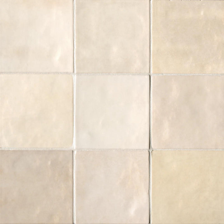 A bird’s-eye view of the Cloe Crème 5X5 glossy ceramic tile highlights its soft beige hue and luminous glaze, creating a warm and inviting atmosphere.