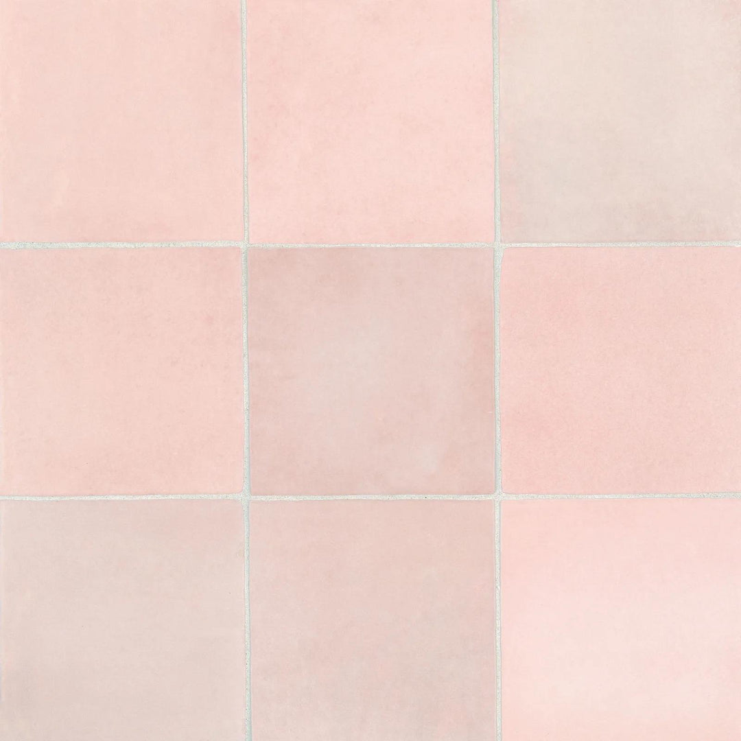 From above, the Cloe Pink 5X5 glossy ceramic tile radiates a soft blush tone with a lustrous finish, adding a playful yet elegant charm.