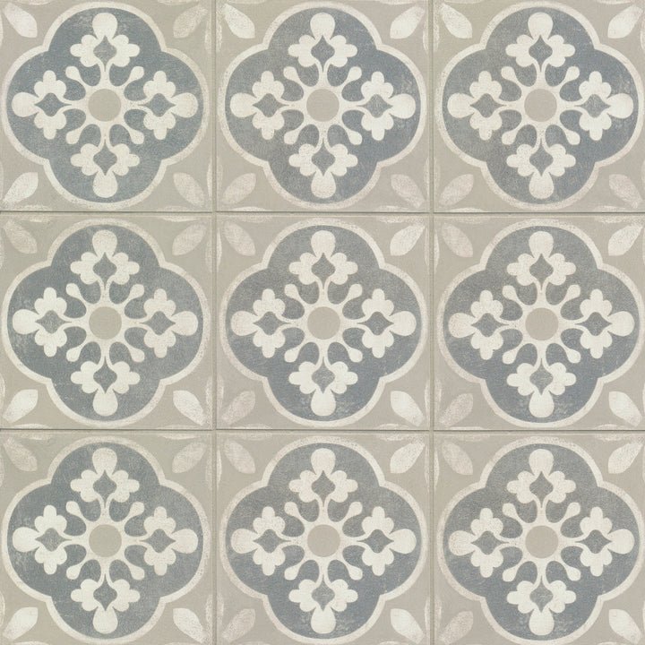 A top-down view of the Enchante Charm 8X8 matte glazed color body porcelain tile showcases its soft, intricate pattern with a refined matte finish, adding vintage elegance to any space.