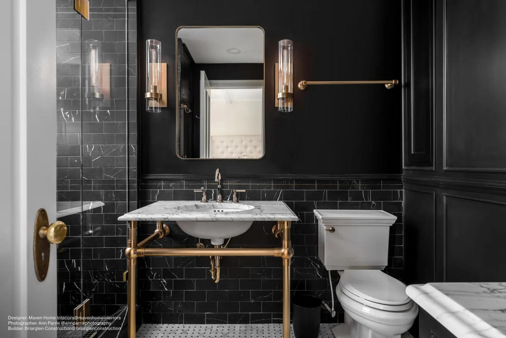 A decorative honed marble tile with brass inlays, creating a luxurious effect with Ferrara Nero Deco 3X6 Honed Marble, Brass.