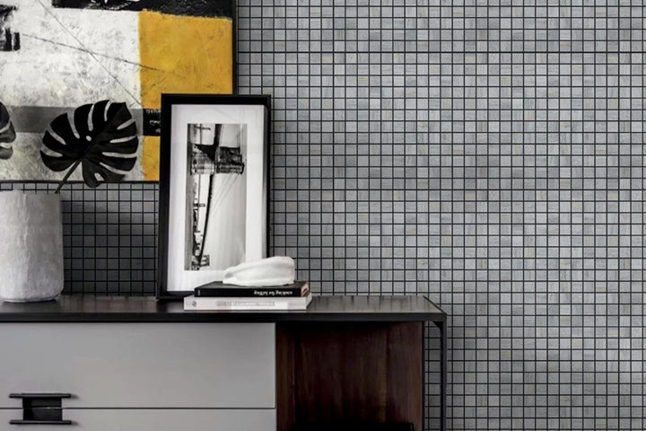 A classic square mosaic design with honed marble and brass accents, featured in Ferrara Argento 1" Square Honed Marble, Brass Mosaic.