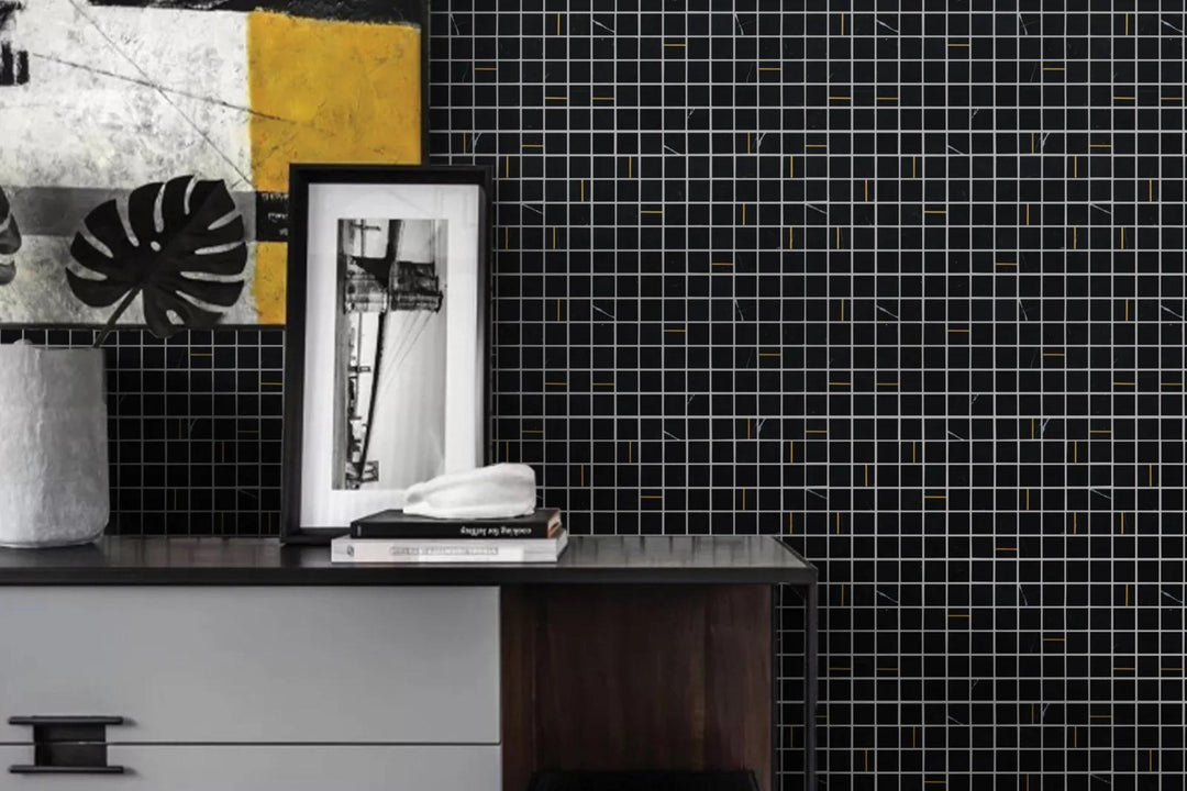 A bold nero marble square mosaic with brass inlays, offering a timeless look with Ferrara Nero 1" Square Honed Marble, Brass Mosaic.