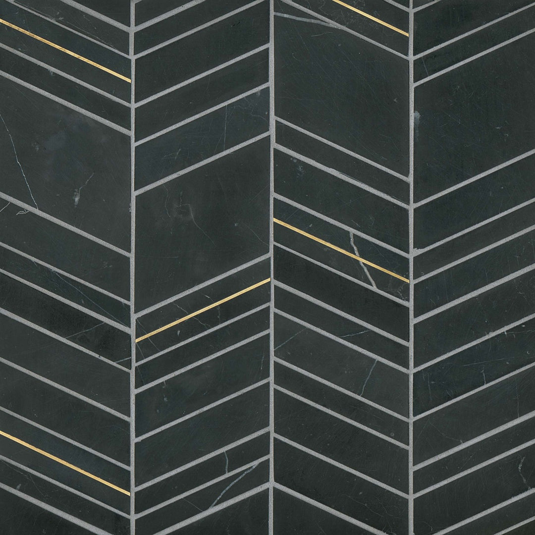 From a top-down perspective, the Ferrara Nero Chevron honed marble mosaic exudes bold elegance, featuring deep black marble with striking brass inlays that form a sleek, modern pattern.