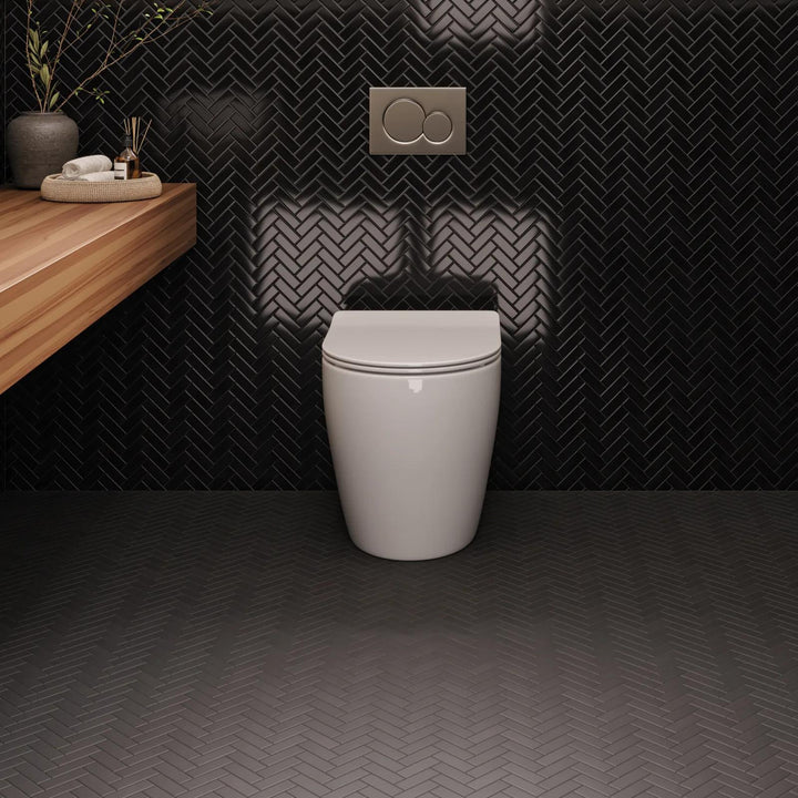 A dynamic matte black herringbone mosaic, showcasing movement and depth with Le Café Black Herringbone Matte Glazed Porcelain Mosaic.