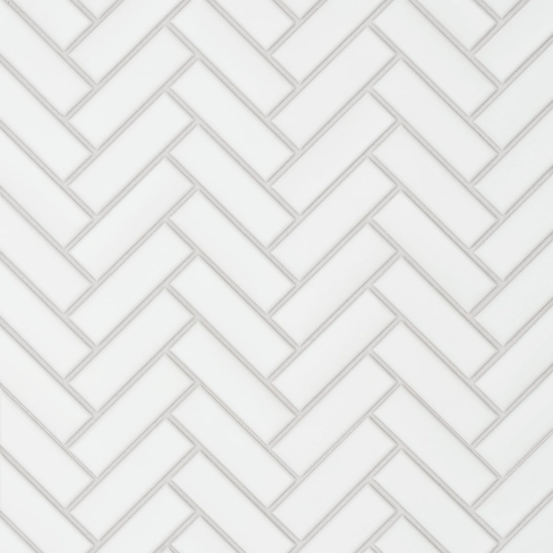 A direct overhead capture of the Le Café White Herringbone Matte Porcelain Mosaic showcases its precise interwoven pattern in a soft white tone, offering a timeless yet contemporary aesthetic.