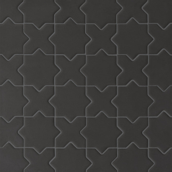 A top-down perspective of the Le Café Black Cross & Star Matte Porcelain Mosaic showcases a stunning interplay of crosses and star accents in a bold black matte finish, creating a striking geometric statement.