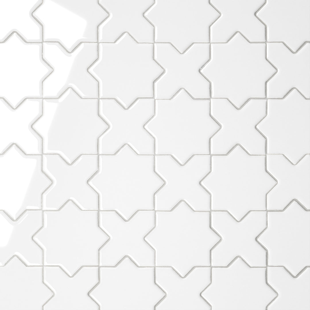 A direct overhead view of the Le Café White Cross & Star Gloss Porcelain Mosaic showcases its pristine white surface with a polished finish, accentuating the delicate star-and-cross interplay with a luminous effect.
