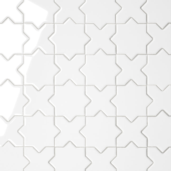 A direct overhead view of the Le Café White Cross & Star Gloss Porcelain Mosaic showcases its pristine white surface with a polished finish, accentuating the delicate star-and-cross interplay with a luminous effect.
