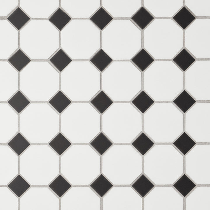 This overhead shot of the Le Café White/Black Octagon Matte Porcelain Mosaic captures a bold contrast of black accents against a white octagonal base, offering a vintage yet modern geometric charm.