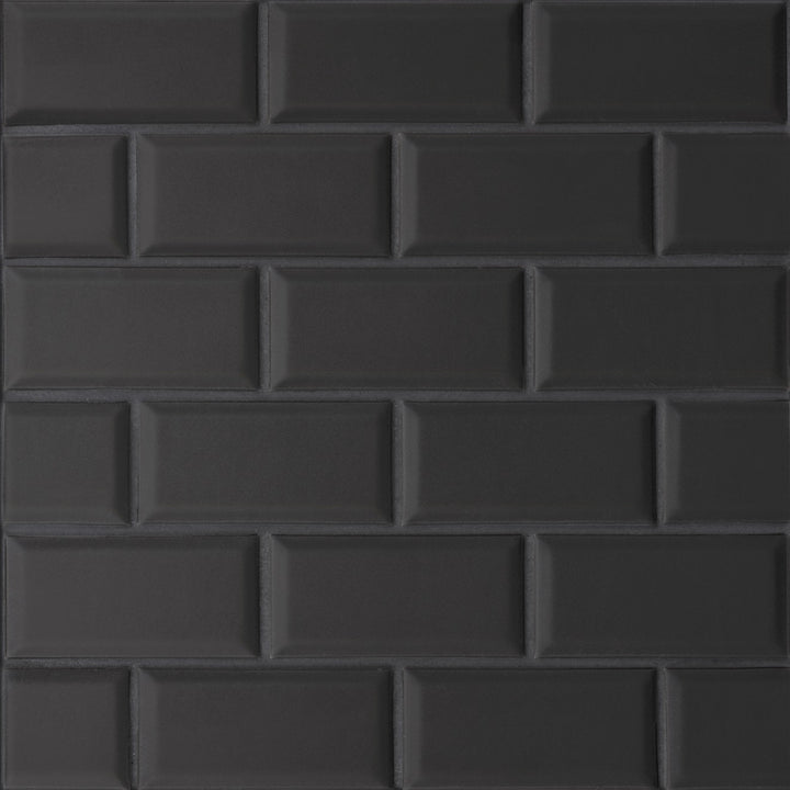 A top-down perspective of the Le Café Black Bevel Offset matte mosaic showcases its structured beveling and deep black hue, creating a sophisticated, dimensional surface.
