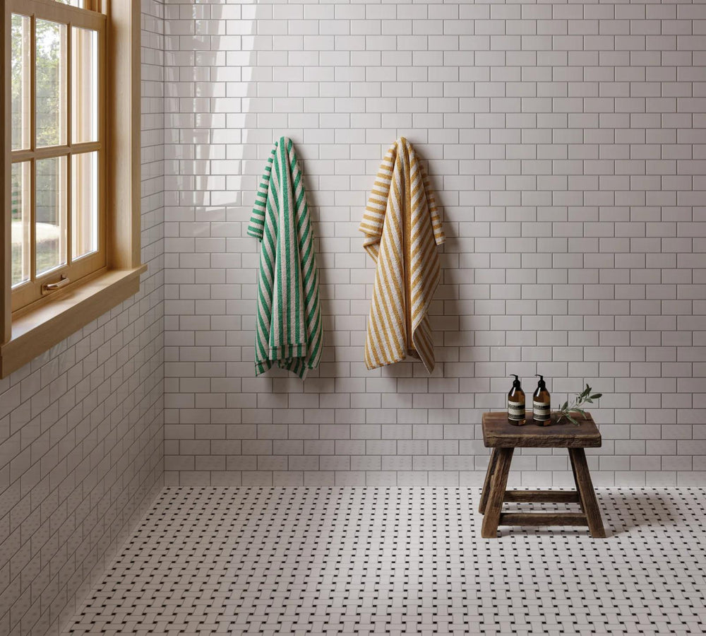 A basketweave mosaic combining white and black tones in a mix of glossy and matte glazed porcelain, adding texture and depth with Le Café White/Black Basketweave Gloss And Matte Glazed Porcelain Mosaic.