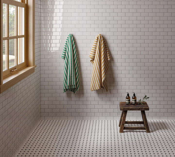 A basketweave mosaic combining white and black tones in a mix of glossy and matte glazed porcelain, adding texture and depth with Le Café White/Black Basketweave Gloss And Matte Glazed Porcelain Mosaic.