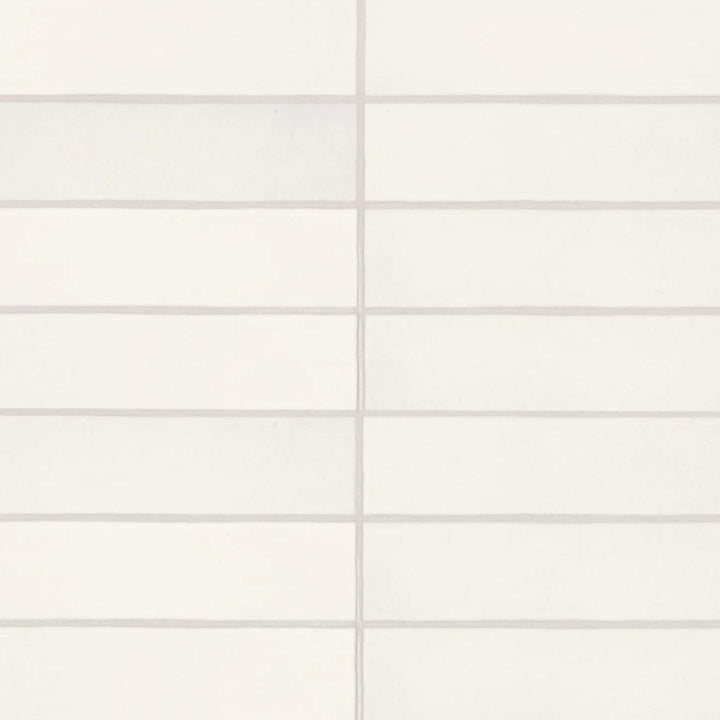 An overhead view of the Makoto Shoji White 2.5X10 matte ceramic tile showcases its soft white surface, offering a minimalist yet warm aesthetic with a handcrafted feel.