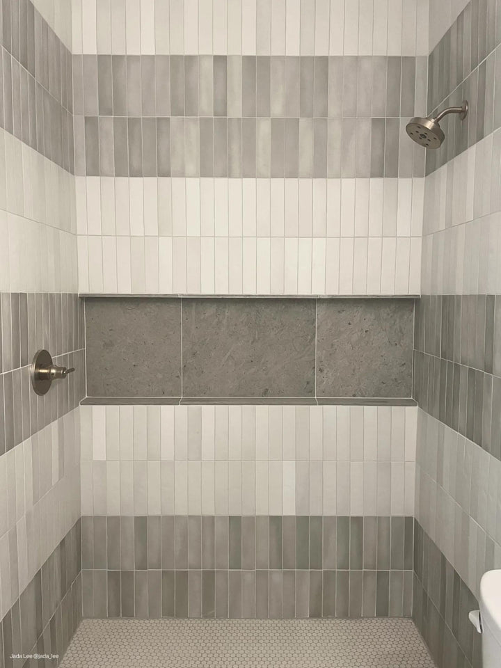 A muted gray matte ceramic tile blends seamlessly with various design styles, adding depth and elegance with Makoto Kumo Grey 2.5x10 matte ceramic.