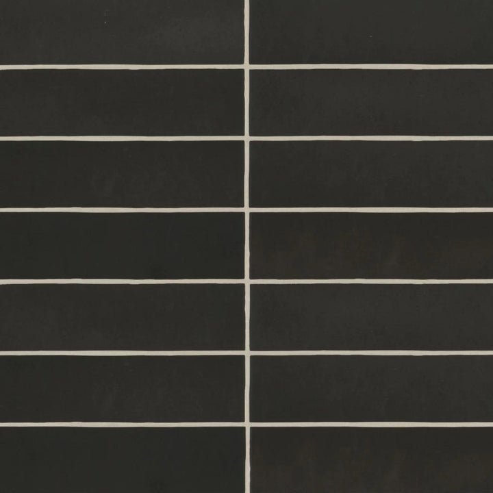 An aerial view of the Makoto Kuroi Black 2.5X10 matte ceramic tile reveals its deep, velvety black finish, bringing a bold and contemporary statement to any space.