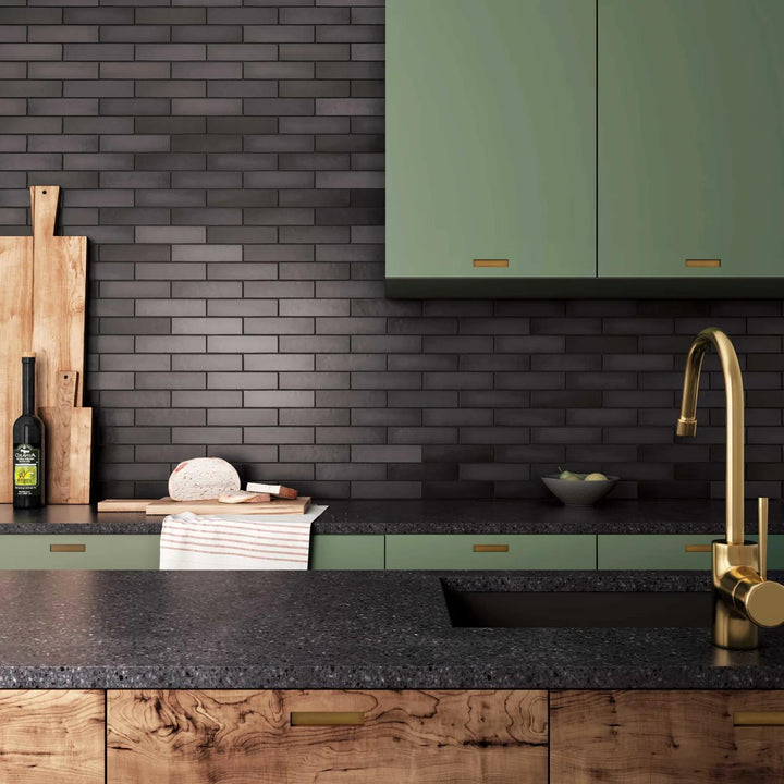 A lifestyle-driven space accentuated by deep black ceramic tiles in a 2.5x10 matte finish, adding bold contrast with Makoto Kuroi Black Matte Ceramic.