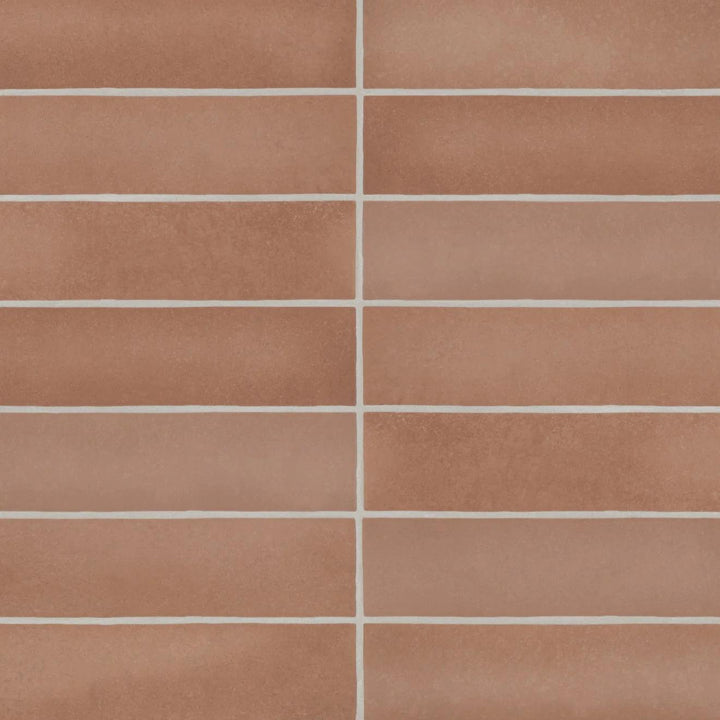 From a top-down perspective, the Makoto Umi Terracotta 2.5X10 matte ceramic tile showcases its earthy reddish-brown hue, inspired by sunbaked clay and natural elements.