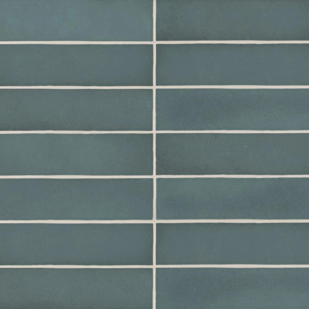 A bird’s-eye view of the Makoto Arashi Blue 2.5X10 matte ceramic tile highlights its deep oceanic tone, reminiscent of stormy seas with a velvety matte finish.