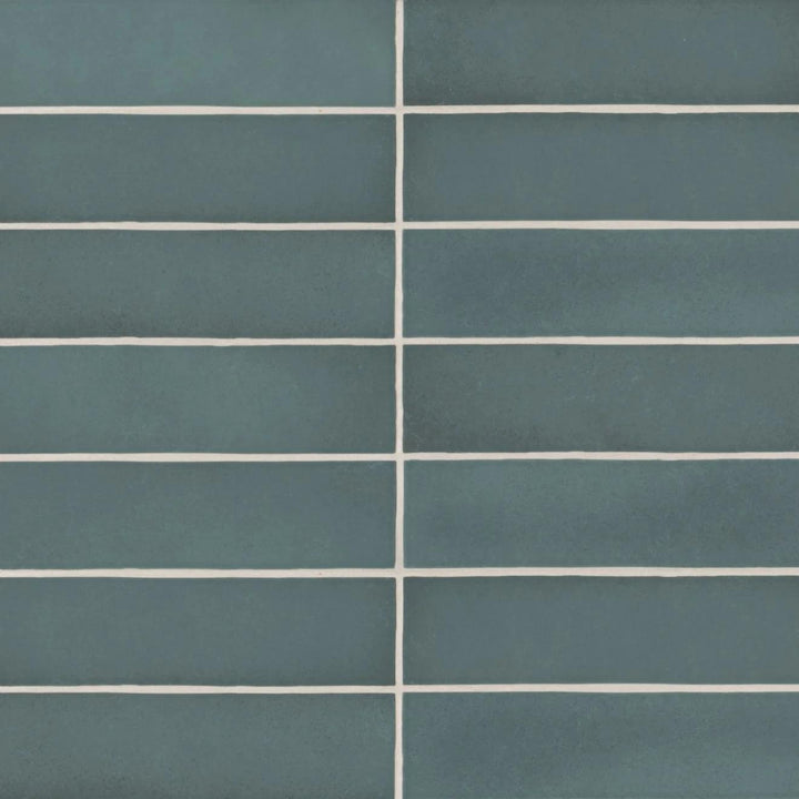 A bird’s-eye view of the Makoto Arashi Blue 2.5X10 matte ceramic tile highlights its deep oceanic tone, reminiscent of stormy seas with a velvety matte finish.