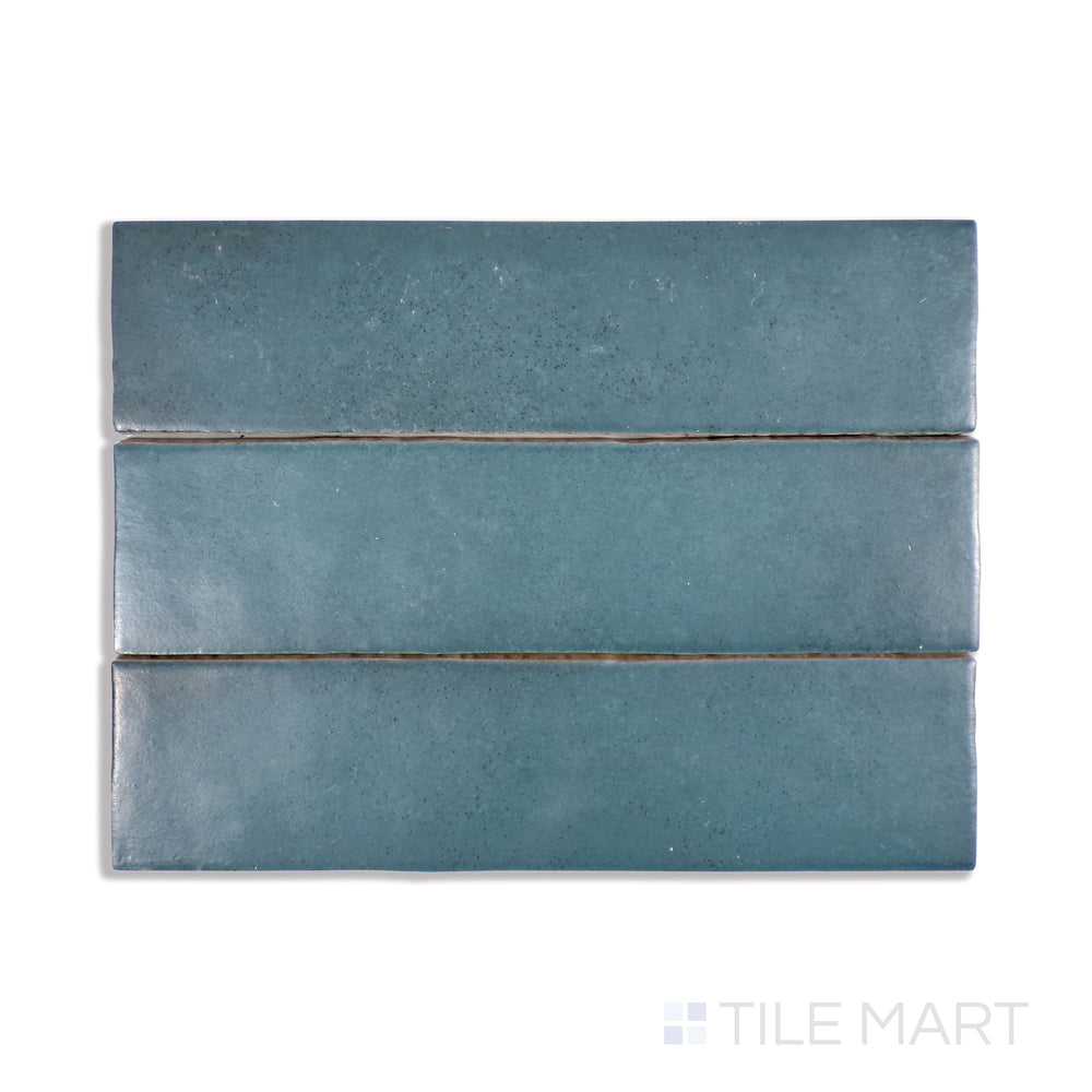 A macro view of Makoto Arashi Blue 2.5X10 Matte Ceramic tile emphasizes its stormy blue shade and velvety matte finish, delivering a cool and dramatic ambiance.