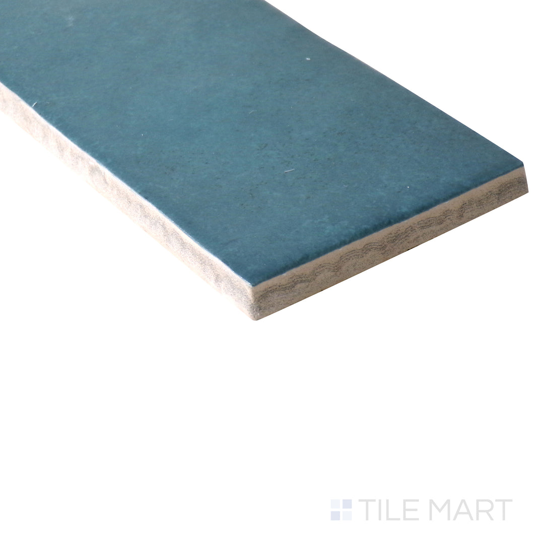 Corner shot of Makoto Arashi Blue 2.5x10 matte ceramic tile, capturing its deep blue shade, soft matte surface, and seamless edge transition.