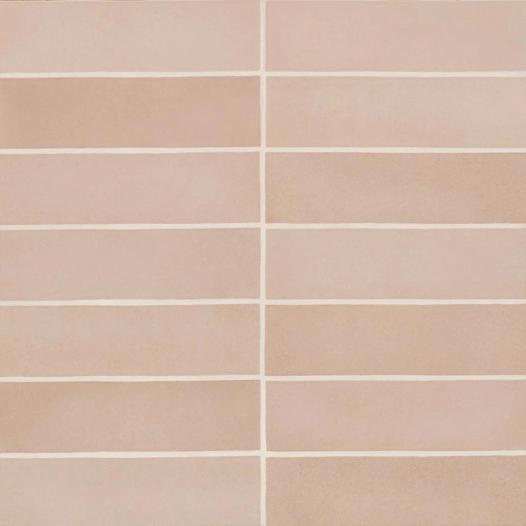 From above, the Makoto Momoiro Blush 2.5X10 matte ceramic tile radiates a soft pink hue with a powdery finish, adding a delicate and inviting charm.
