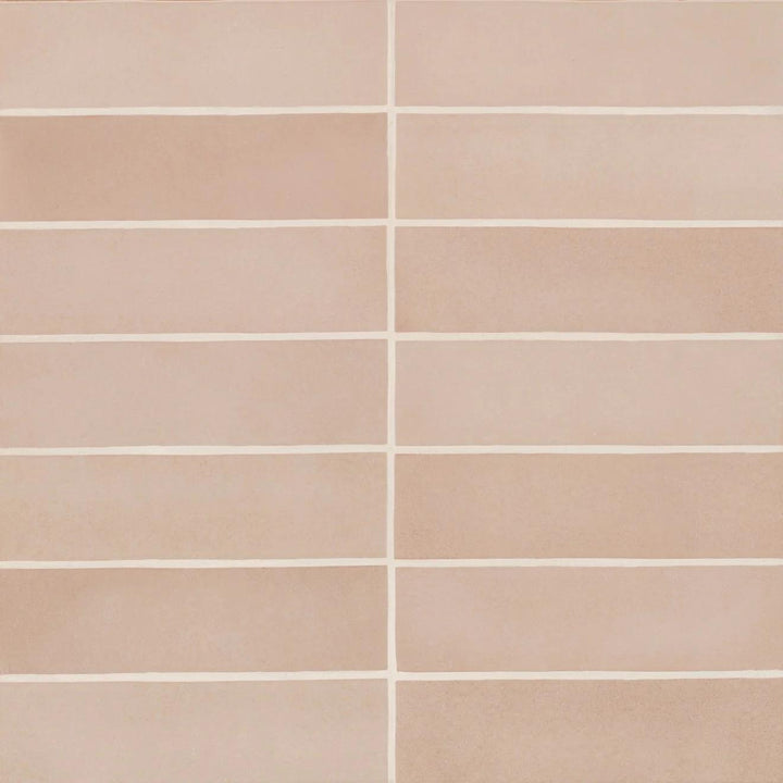 From above, the Makoto Momoiro Blush 2.5X10 matte ceramic tile radiates a soft pink hue with a powdery finish, adding a delicate and inviting charm.