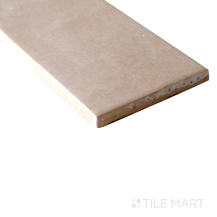 Side-angle close-up of Makoto Momoiro Blush 2.5x10 matte ceramic tile, drawing attention to its soft blush hue, matte surface, and structured edge detailing.