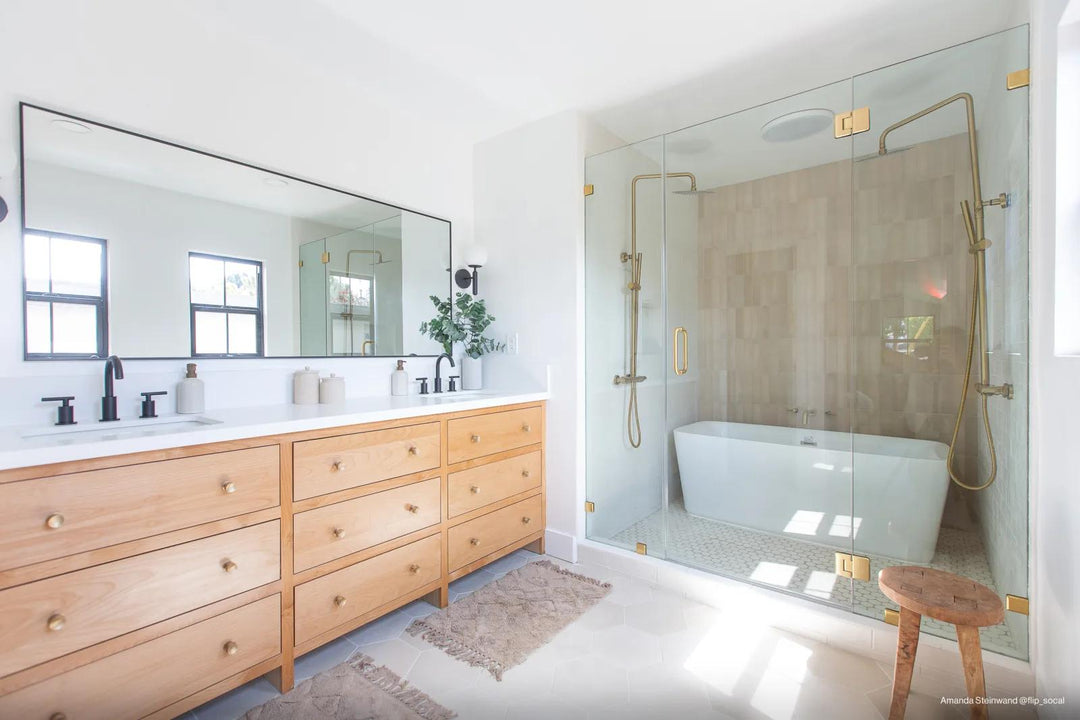 A beautifully tiled accent wall featuring Makoto Shoji White 10" Hex Matte Porcelain, creating an airy, light-filled aesthetic with a soft geometric appeal.