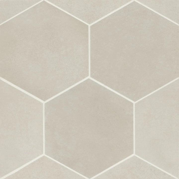 An aerial look at the Makoto Kumo Grey 10" hex matte porcelain tile highlights its balanced grey shade, adding a modern industrial touch with a soft, muted finish.