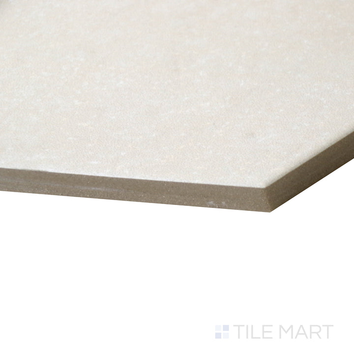 Side-angle perspective of Makoto Tatami Beige 10" hex matte porcelain tile, emphasizing its warm beige hue, finely cut hexagonal shape, and soft matte surface.