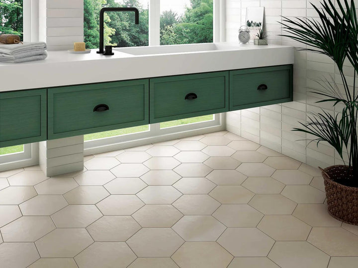 A lifestyle environment complemented by beige hexagonal porcelain tiles in a 10" matte finish, adding warmth and versatility with Makoto Tatami Beige Hex Matte Porcelain.