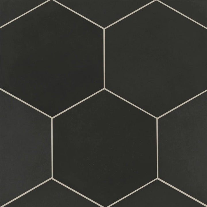 From a top-down angle, the Makoto Kuroi Black 10" hex matte porcelain tile presents a bold black finish with a smooth, matte texture, enhancing depth and sophistication.