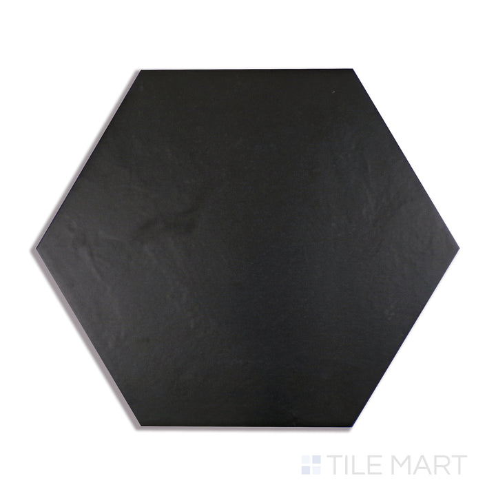 A close-up shot of Makoto Kuroi Black 10" Hex Matte Porcelain tile emphasizes its deep black shade and structured hexagon design, adding bold contrast to any space.