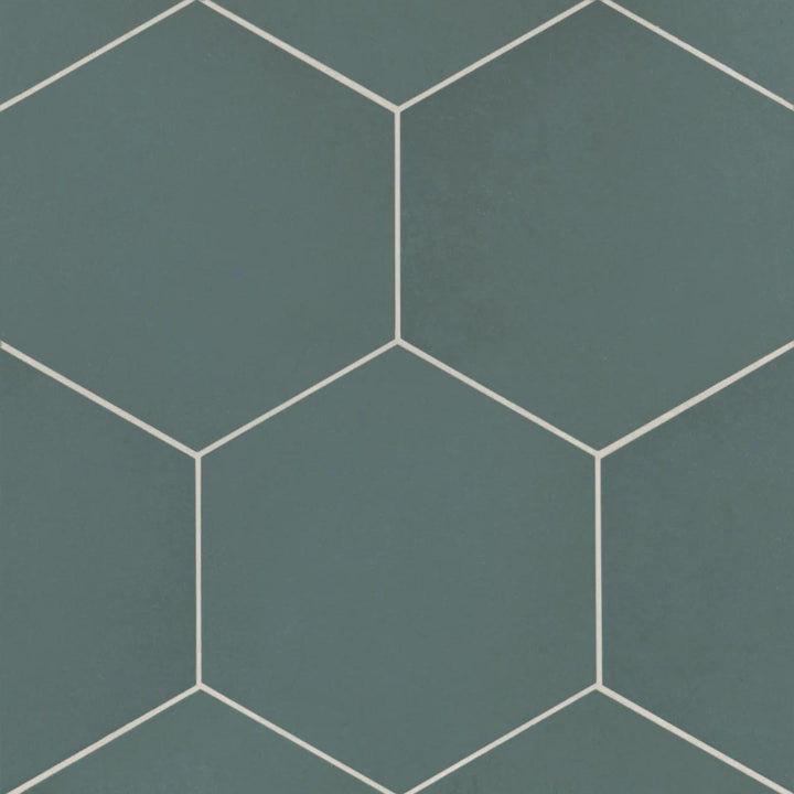 An overhead capture of the Makoto Arashi Blue 10" hex matte porcelain tile showcases its deep blue tone, reminiscent of ocean depths, adding a bold yet sophisticated touch.
