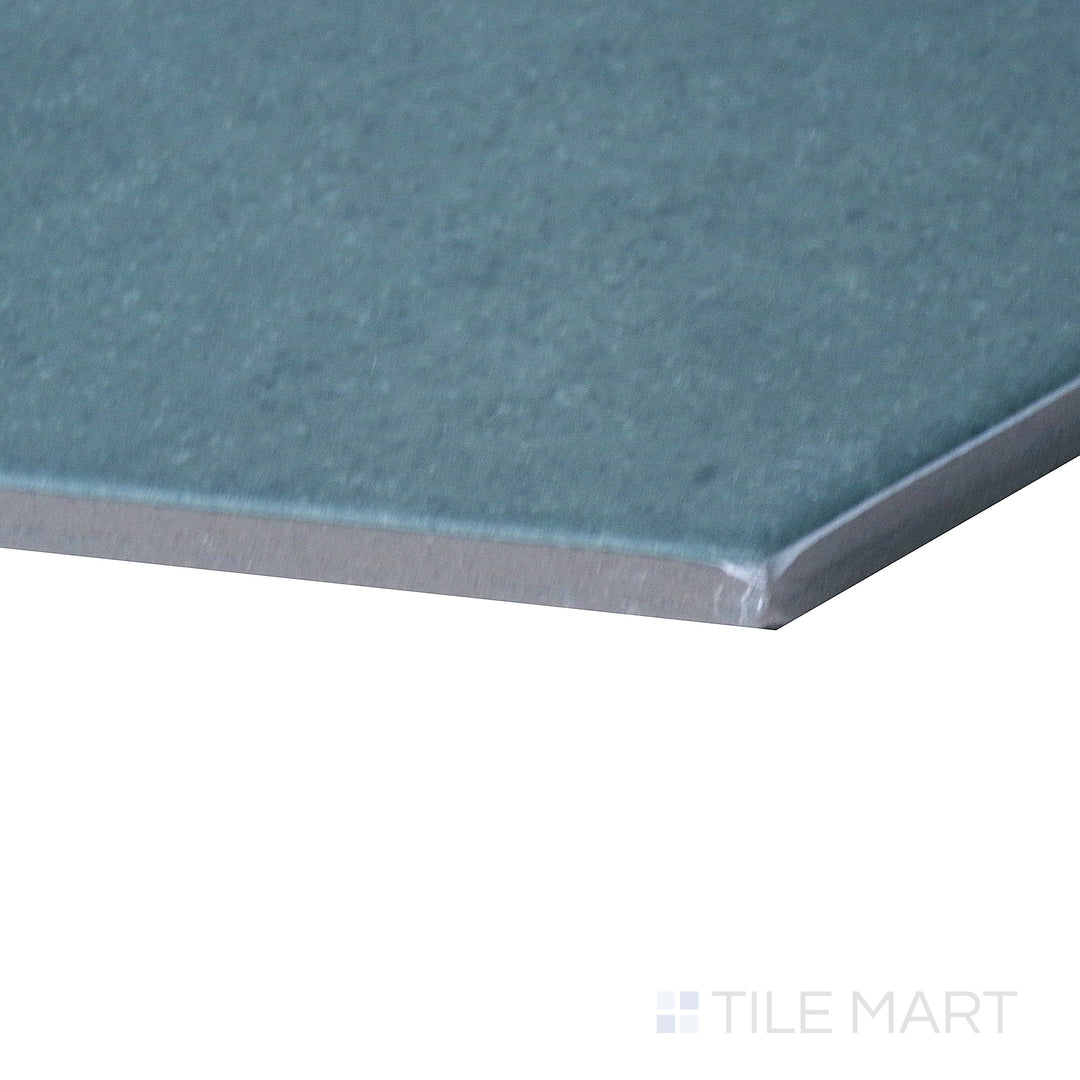 Corner shot of Makoto Arashi Blue 10" hex matte porcelain tile, drawing attention to its rich blue shade, clean-cut hexagonal edges, and smooth matte texture.